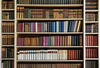 a close up of a book shelf filled with books